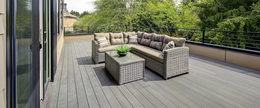 A slate gray trex decking with furniture on it
