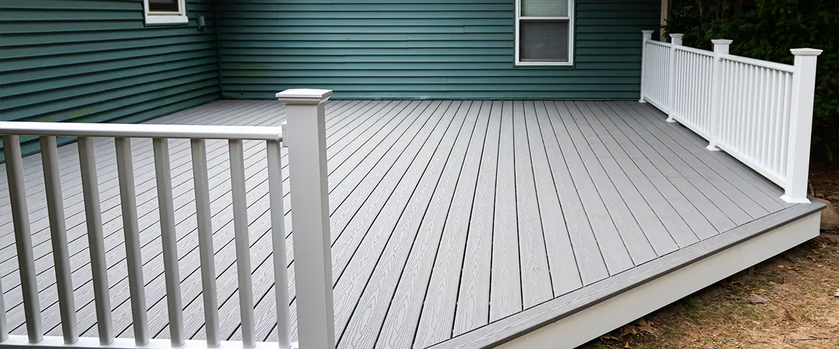 A slate gray decking with white rails