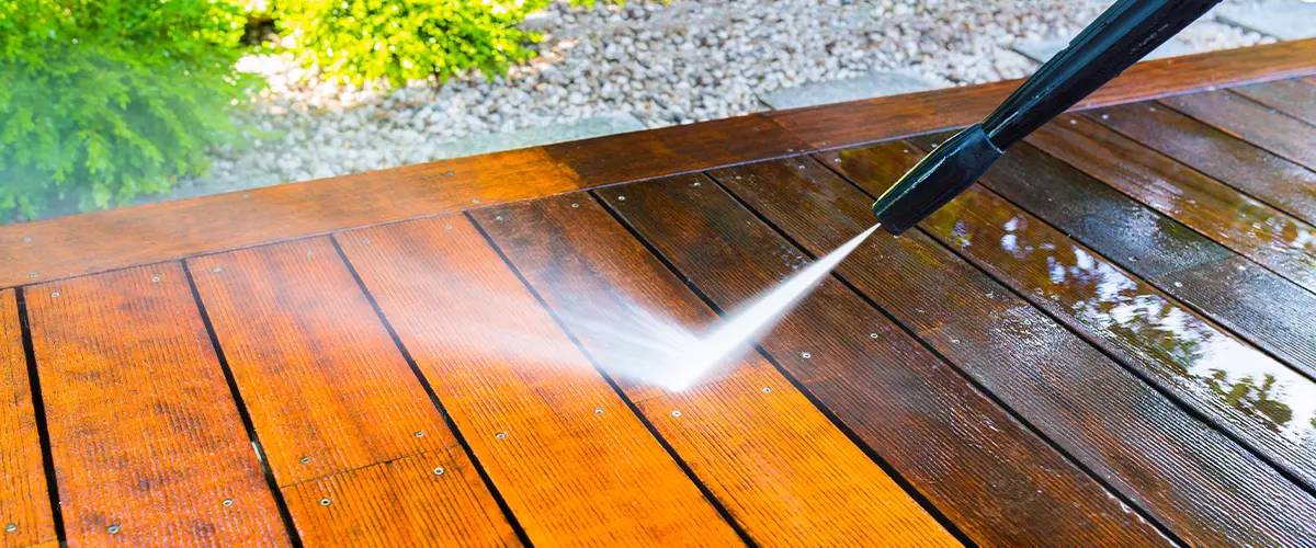 Cleaning a deck with a pressure washer