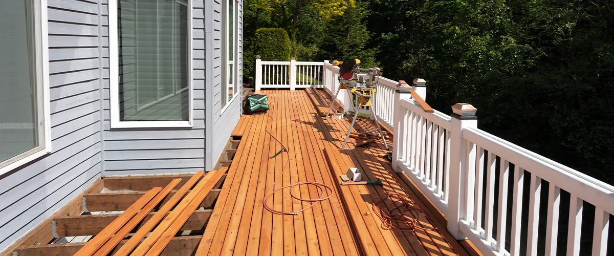 A cedar decking installation in progress with permits for decks needed