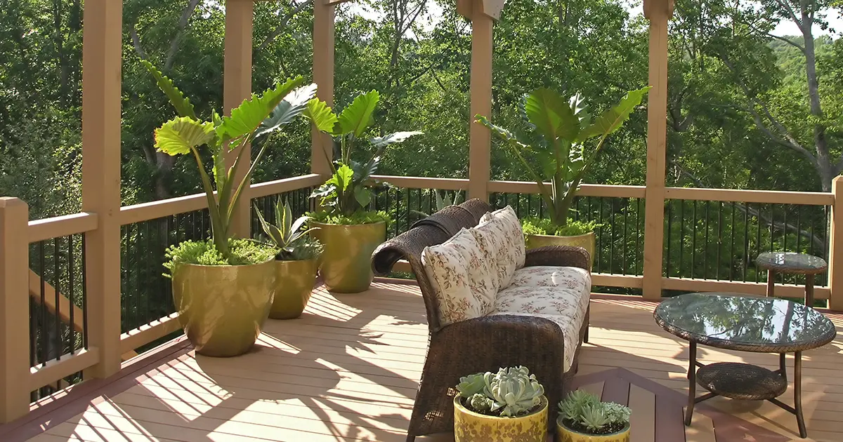 Luxurious new deck with lush plants and seating area