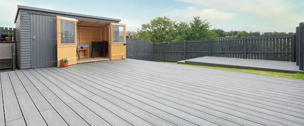 Gray slate composite decking with a shack