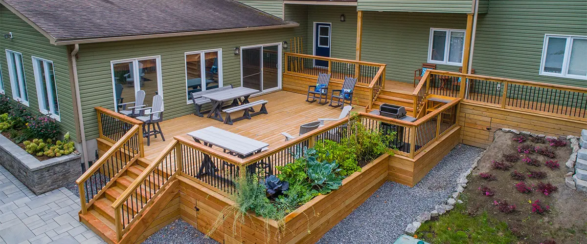 Large wood decking with railing and outdoor furniture