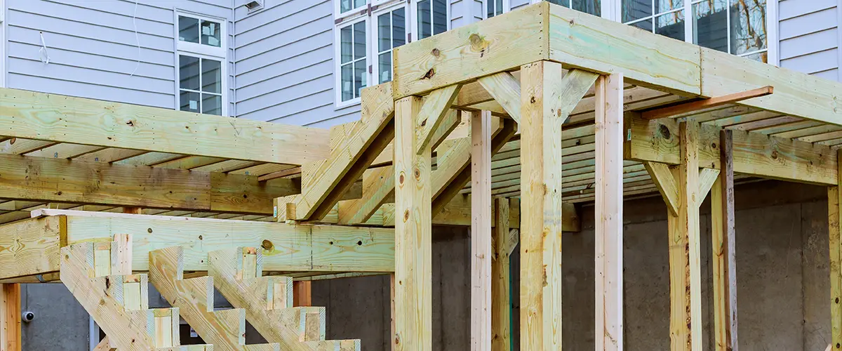 A pressure-treated wood frame for an elevated deck
