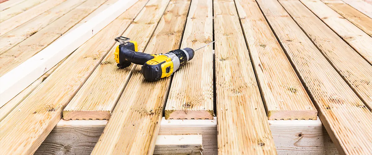 Resurfacing wood decking with composite decking