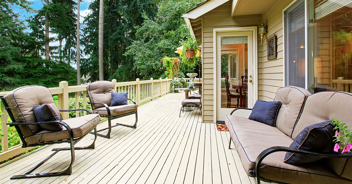 Wood decking stained beige and outdoor furniture