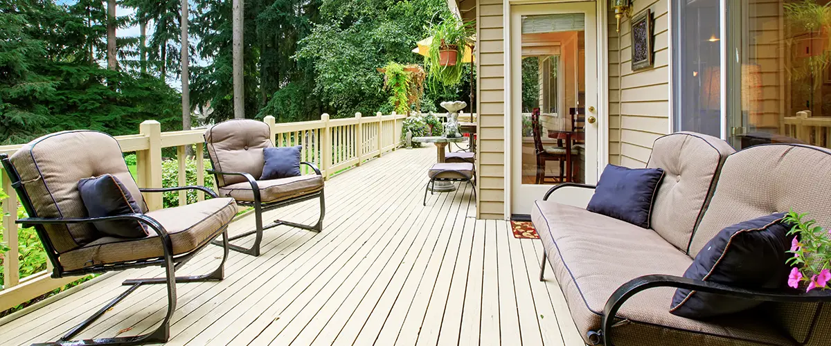 Wood decking stained beige and outdoor furniture