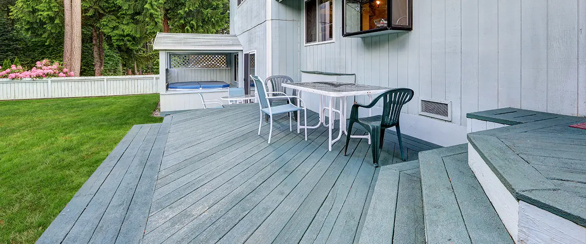 Faded decking with outdoor furniture