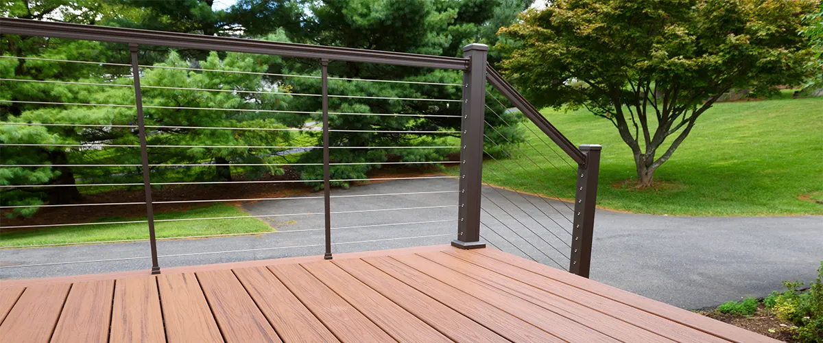 Metal railing on beige composite decking