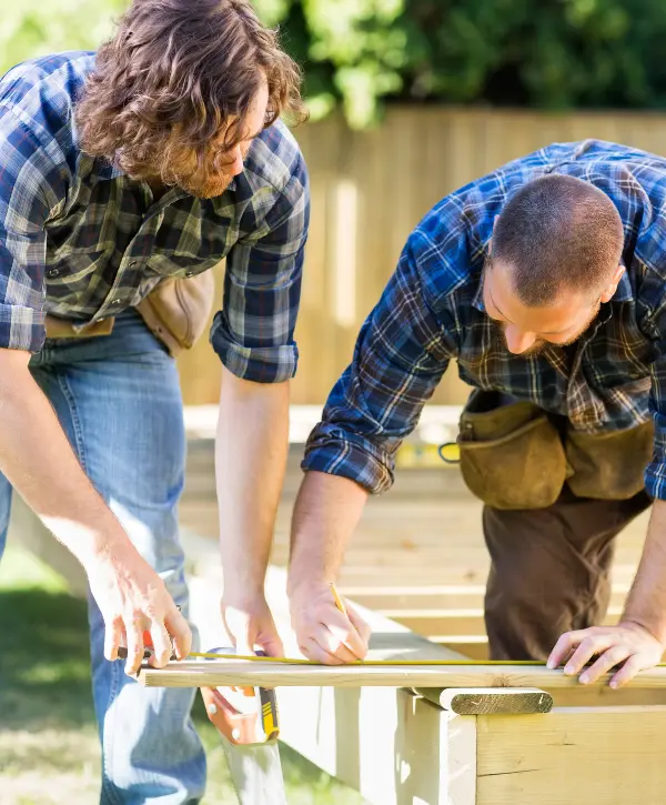 two men building a deck